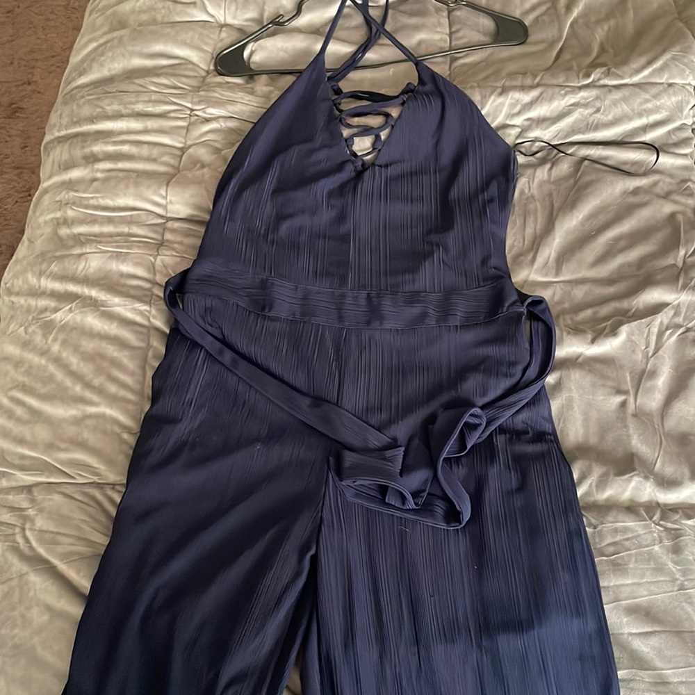Elegant jumpsuit from boutique Seven by Lu. Color is Navy blue.